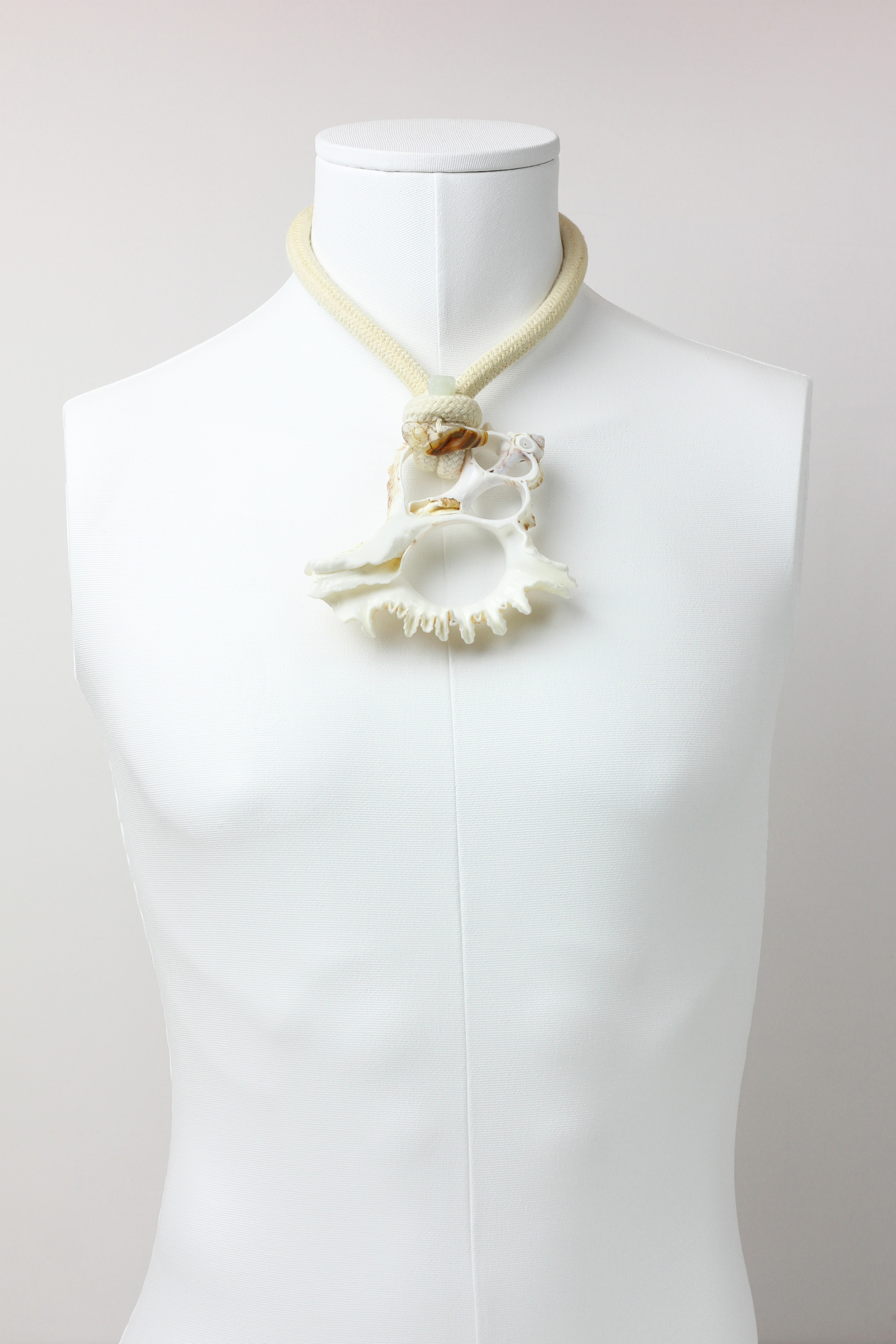 Conch shell necklace with jade skull